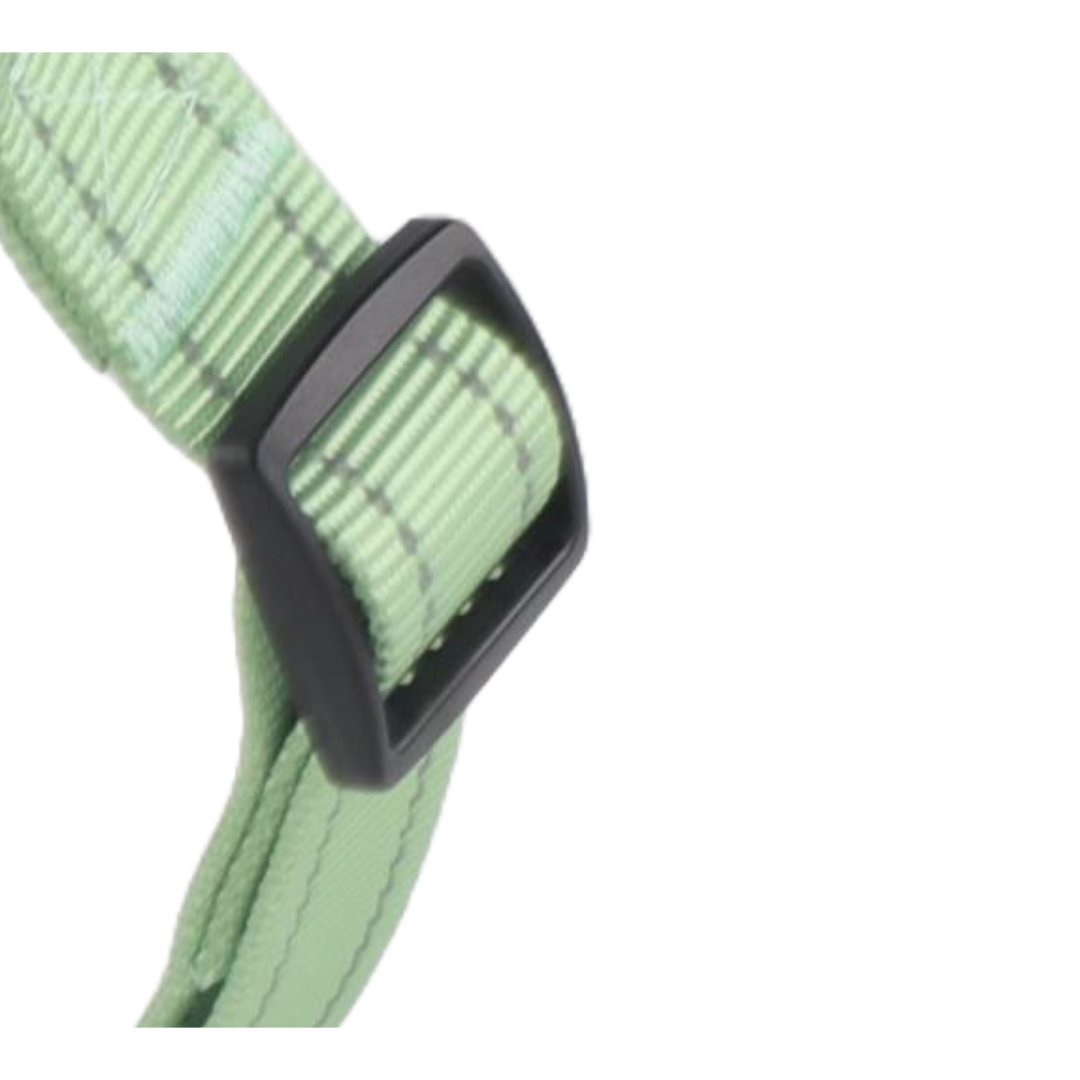 Peppermint green adjustable step-in dog harness with reflective stitching and black buckle.