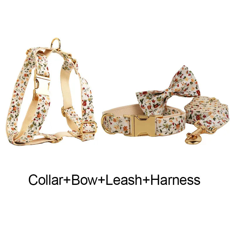 Luxury dog harness set with floral design, collar, bow tie, leash, and quick-release buckle, customizable with dog's name.