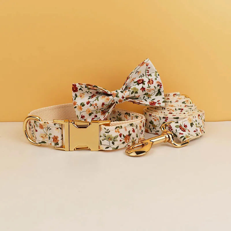 Floral dog harness set with engravable name option, featuring a soft cotton material, bow tie, and leash.