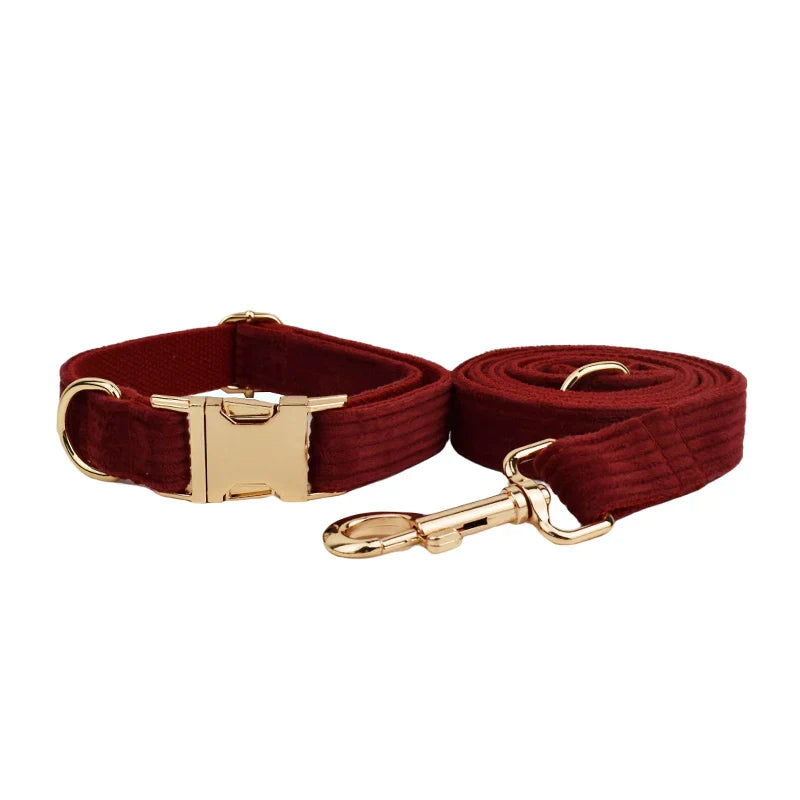 Luxury red handmade corduroy pet accessories with gold metal hardware.