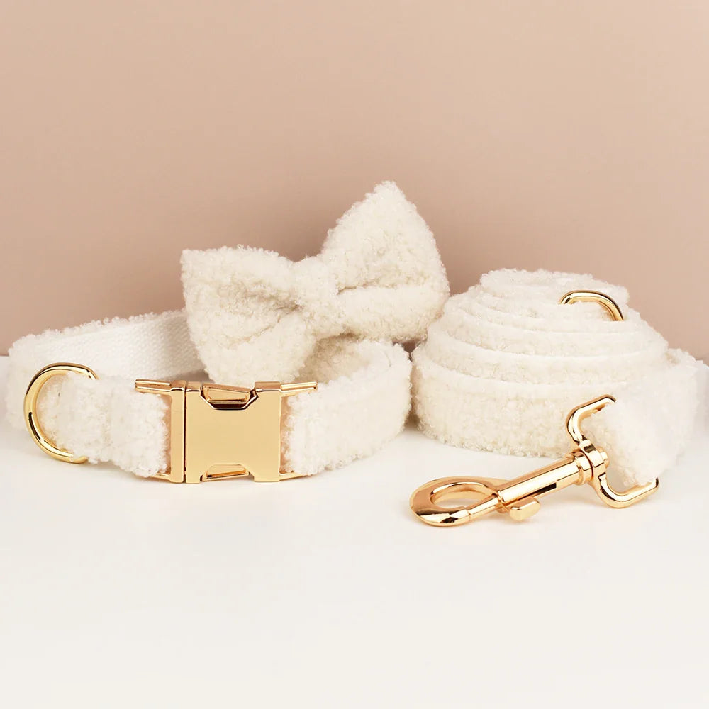 Elegant white teddy fabric dog harness set with gold-tone hardware and detachable bowtie for weddings.