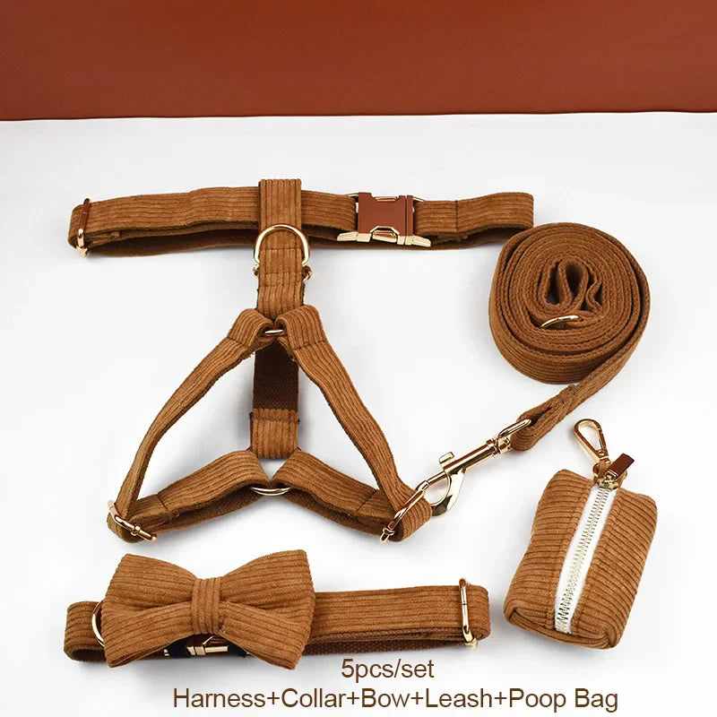 Caramel corduroy dog collar set with harness, bowtie, leash, and poop bag accessory.