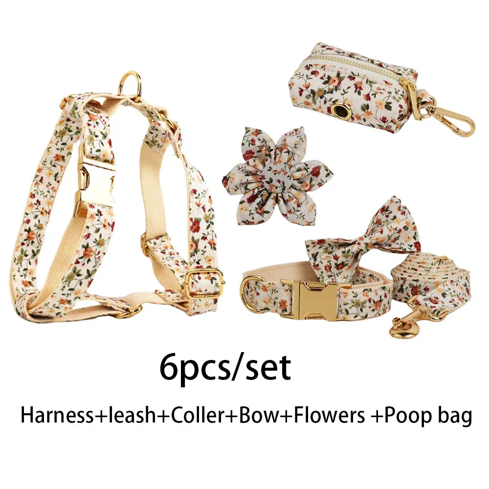 Handmade floral dog harness set with collar, leash, bow, detachable flower, and poop bag holder; customizable with pet's name.