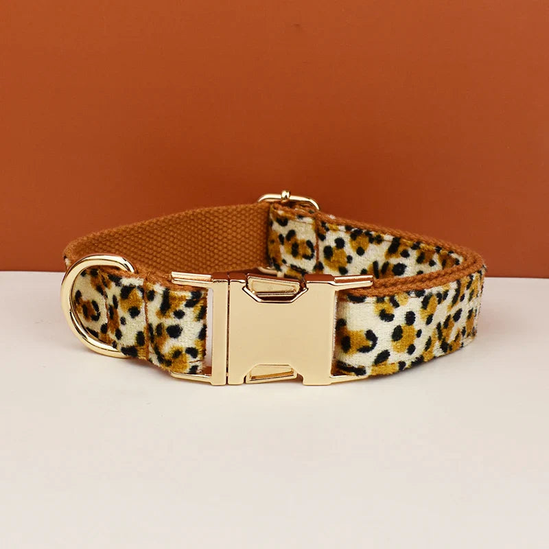 Leopard print dog collar with custom designer logo on brown base.