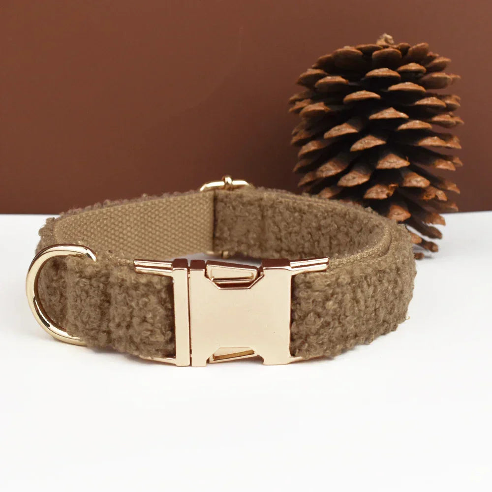 Teddy fleece personalised dog collar with quick-release buckle, shown in brown with pinecone background.