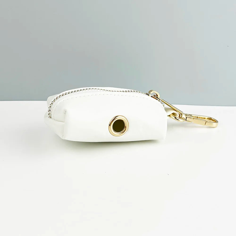White handmade leather luxury pet accessory with engravable features and a gold attachment ring.