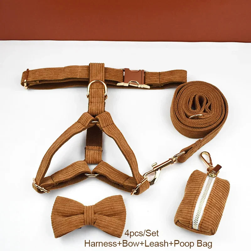 Luxury caramel corduroy dog collar set with harness, bowtie, leash, and poop bag holder.