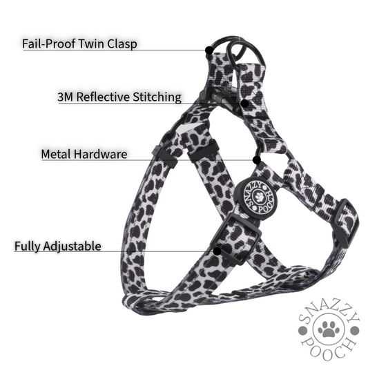 Adjustable cow print dog harness with 3M reflective stitching and secure twin clasp.