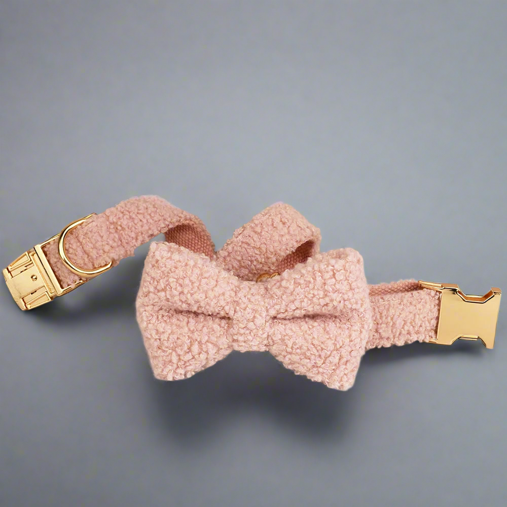 Teddy fleece personalised dog collar with bow tie, quick release mechanism, and gold hardware.