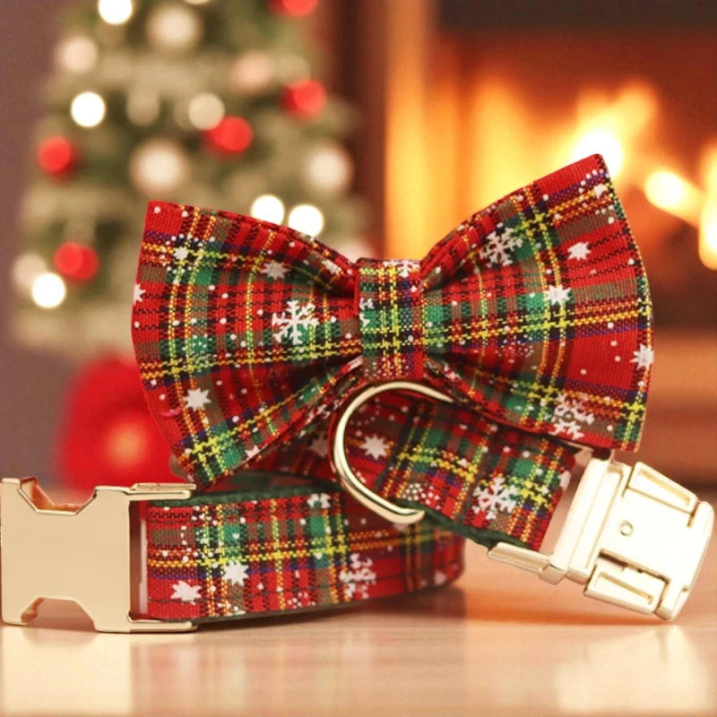 Plaid bow tie with gold buckle on a blurred Christmas tree and fireplace background