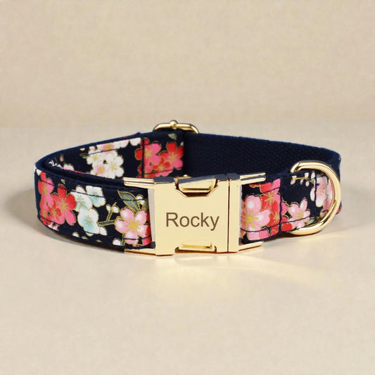 Floral-patterned dog collar with a gold buckle on a beige background