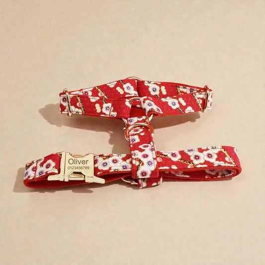 Red floral dog harness and leash set on a beige background