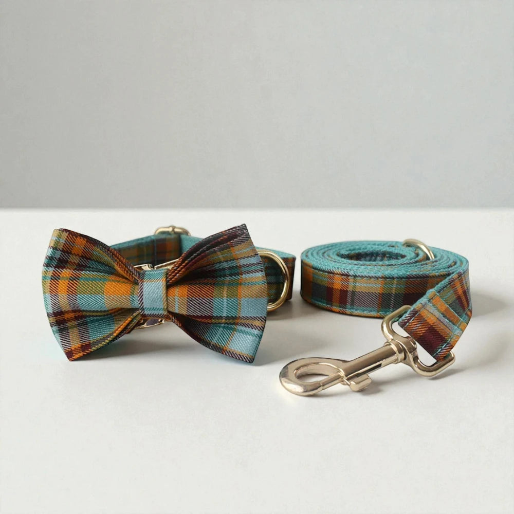 Plaid dog collar with bow tie and matching leash on a white background