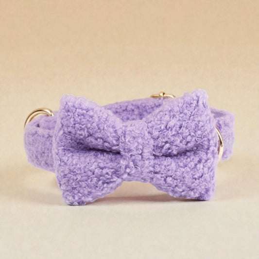 Purple teddy fleece dog bow tie on a beige background