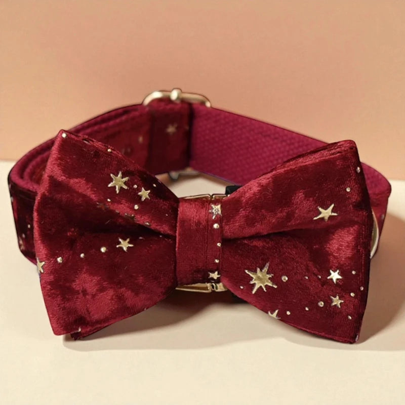 Red velvet bow tie with gold stars on a beige background