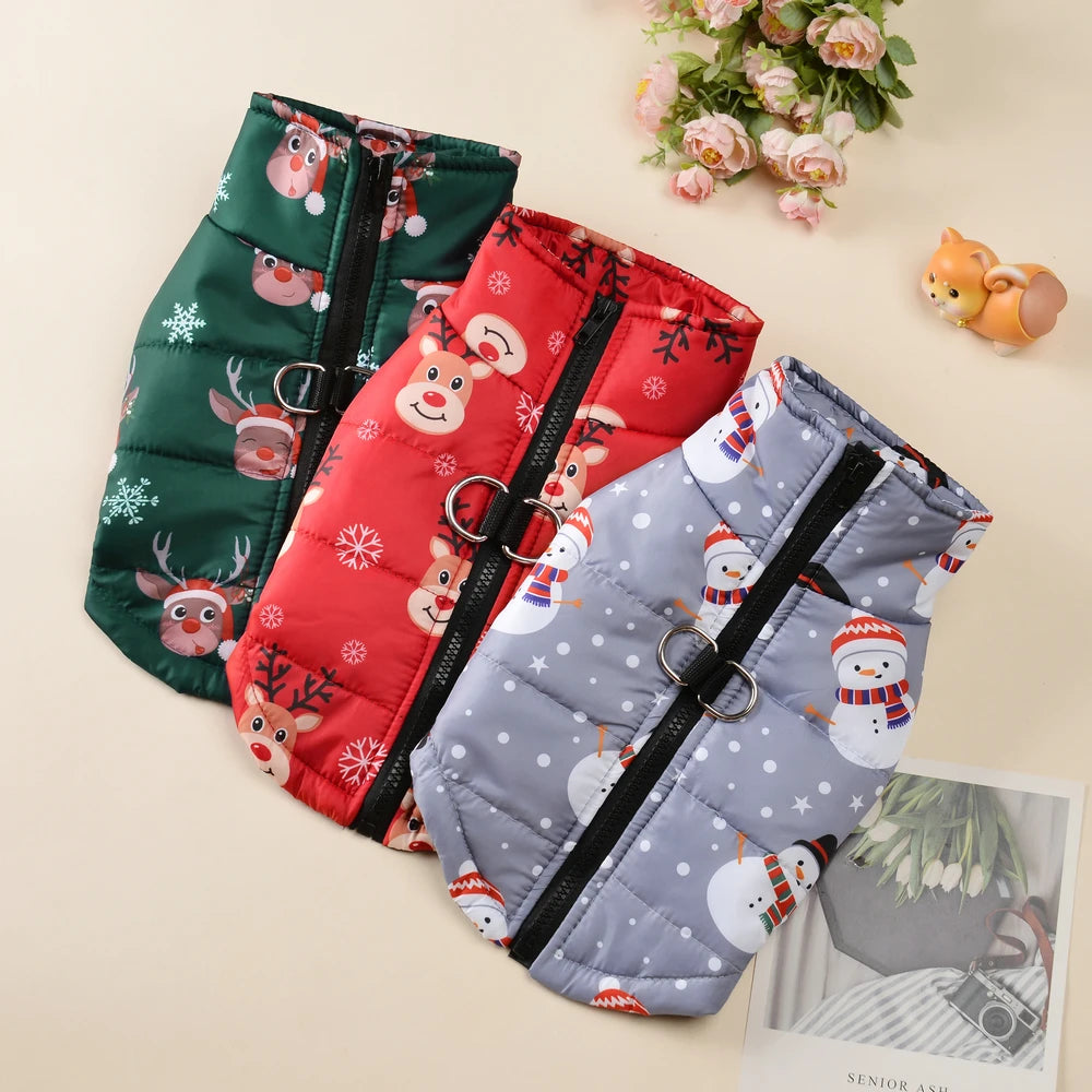 Three festive dog vests with Christmas patterns on a light background.