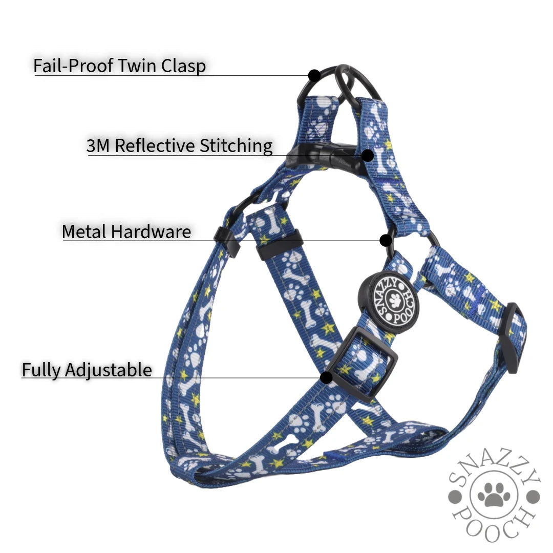 Blue dog harness with bone and star pattern, featuring reflective stitching and a fail-proof clasp.