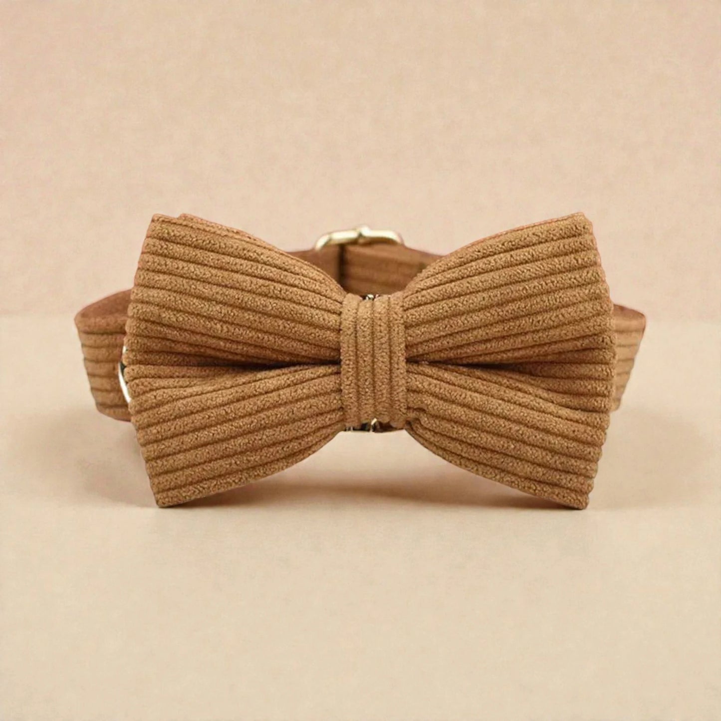 Brown ribbed bow tie on a beige background