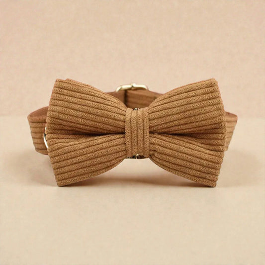 Brown ribbed bow tie on a beige background