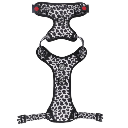 Black and white cow print dog harness.