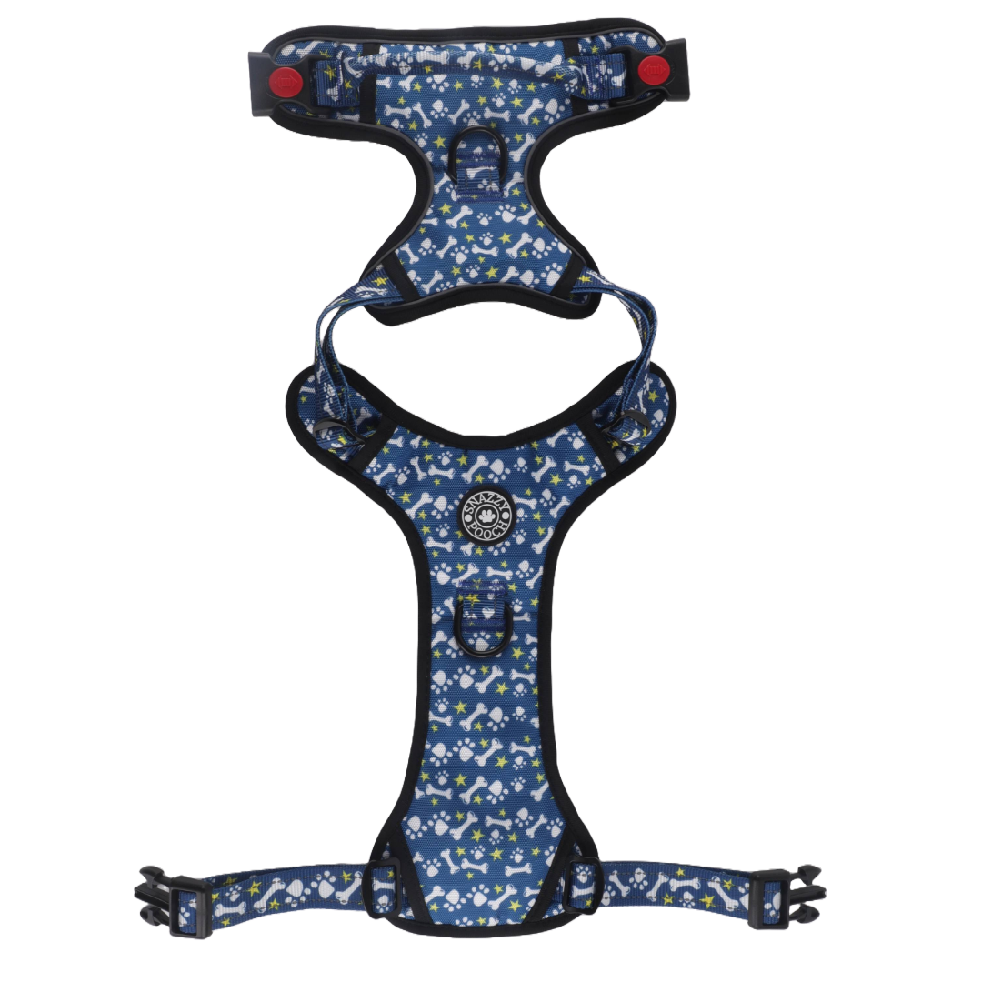 No-pull dog harness with paws and bones design, featuring reflective stitching, locking buckles, front clip for training, and grab handle.