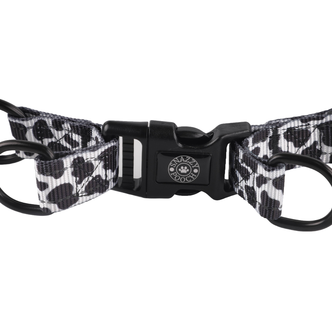Cow print adjustable step-in dog harness with durable clasp.