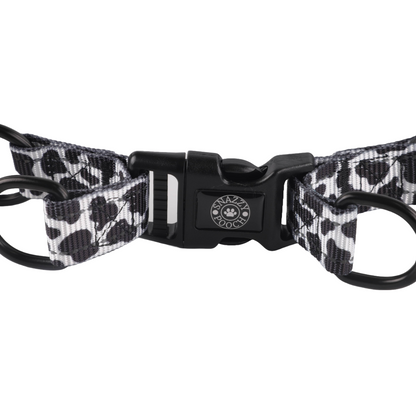 Cow print adjustable step-in dog harness with durable clasp.