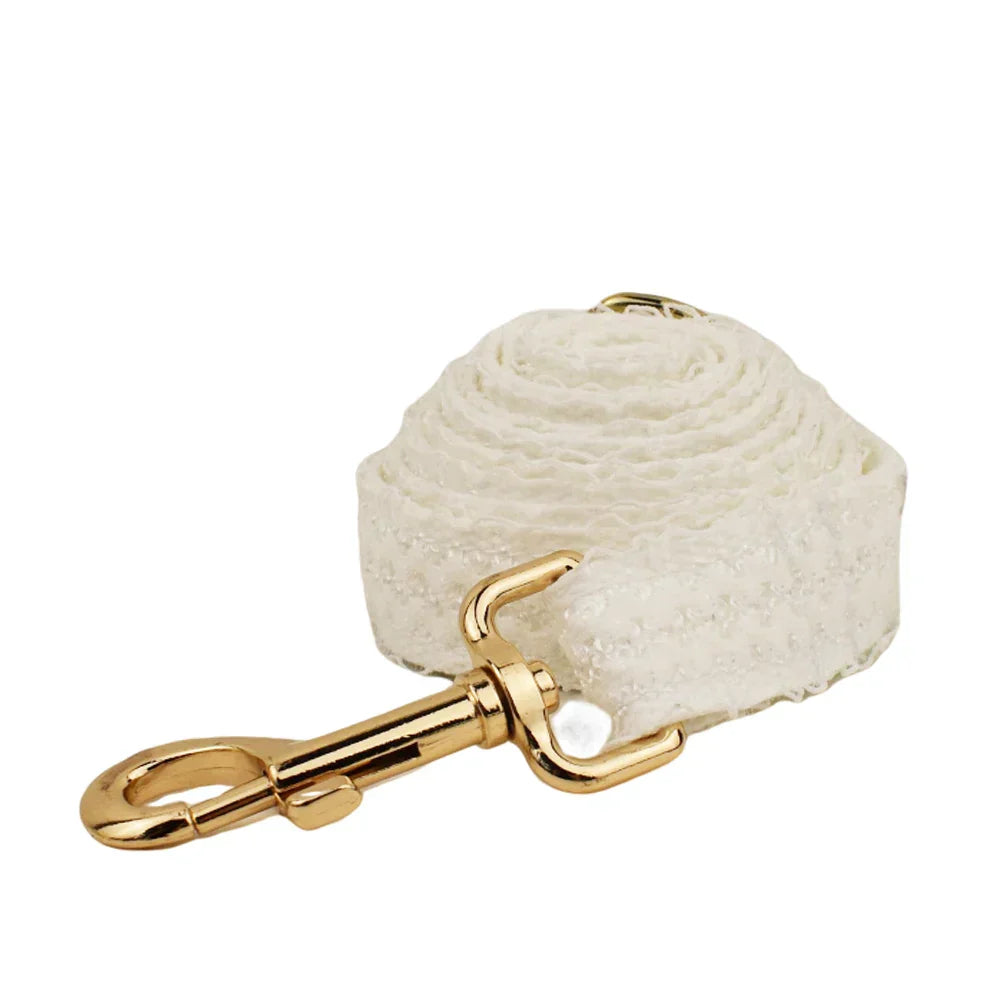 White lace dog leash with gold-tone hardware, perfect for wedding attire.