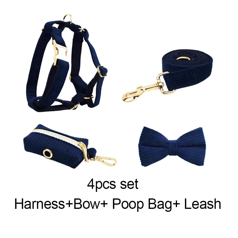 Midnight blue handmade corduroy pet accessory set with harness, bowtie, poop bag holder, and leash.