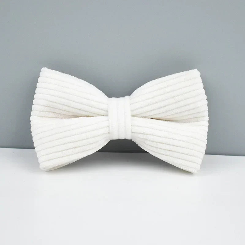 White corduroy dog bowtie from luxury pet accessory collection.
