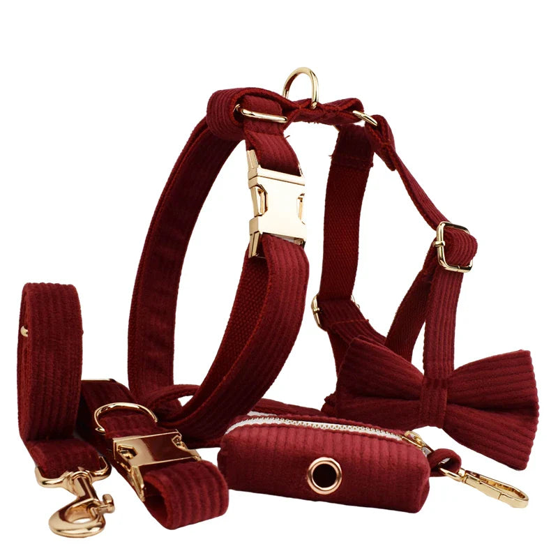Luxury red handmade corduroy pet accessories set with harness, collar, lead, and bowtie.