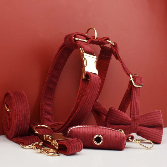 Luxury handmade corduroy fabric pet accessory collection in red with engravable collar, leash, and bowtie.