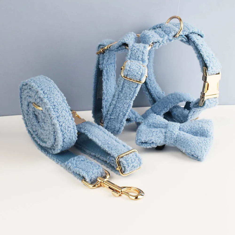 Luxurious pastel blue handmade teddy fabric pet accessories with engravable options, including harness, collar, lead, and bowtie.