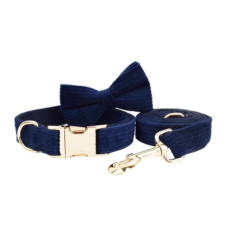 Handmade corduroy fabric pet accessories in midnight blue, featuring a bowtie and gold hardware.