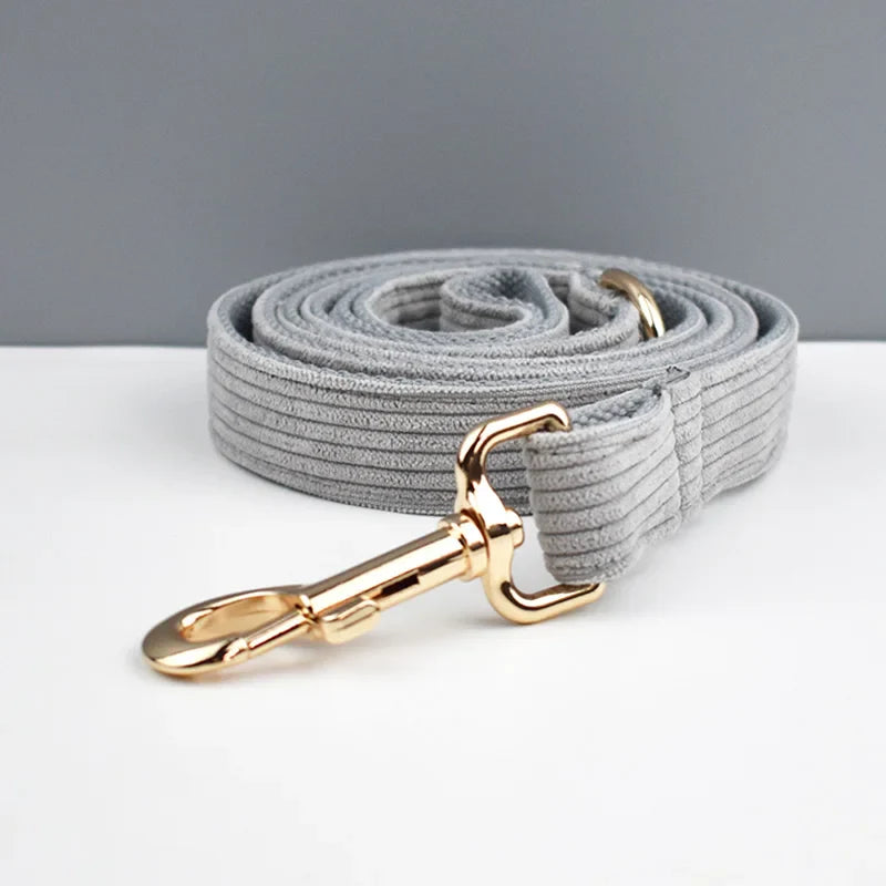 Light grey corduroy dog leash with gold hardware from luxury pet accessories collection.