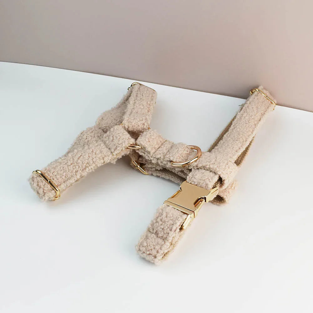 Beige handmade teddy fabric pet harness with gold hardware, luxury accessory for dogs.