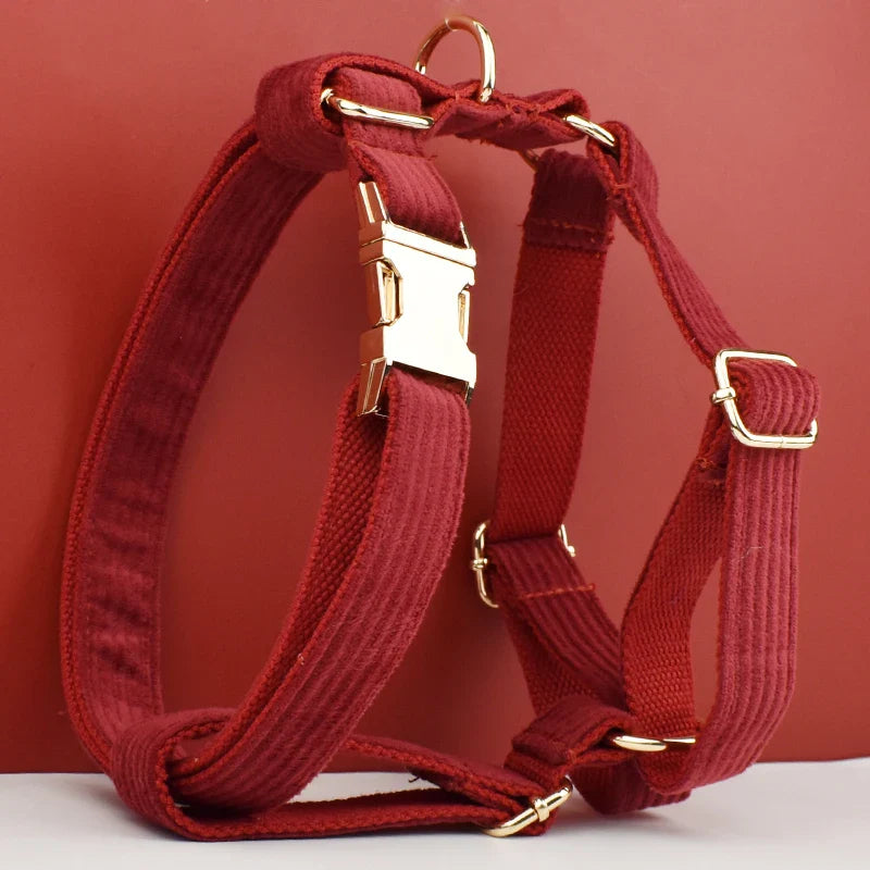 Luxury red corduroy pet harness with gold hardware; handmade, engravable, and stylish for comfort and elegance.