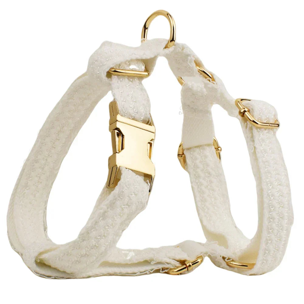 White lace dog harness with gold-tone hardware, ideal for weddings.