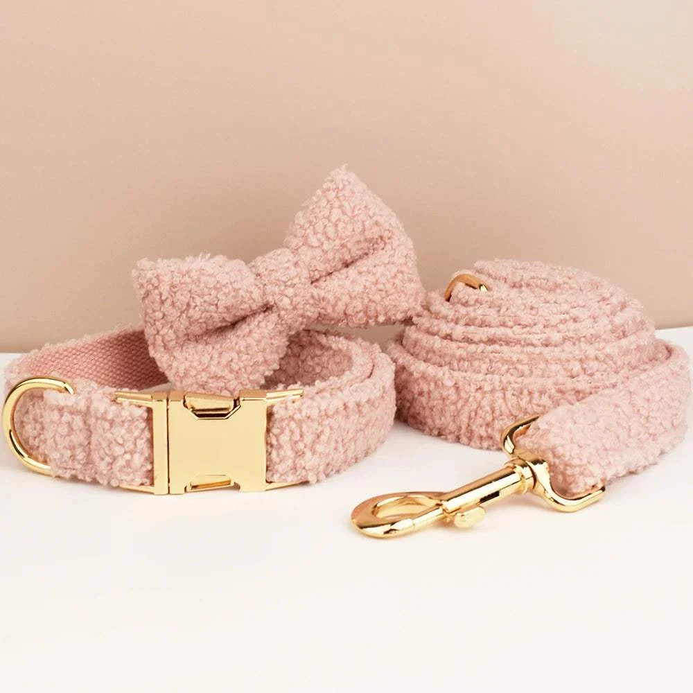 Handmade pink teddy fabric pet accessories set with collar, lead, and bowtie featuring gold hardware.