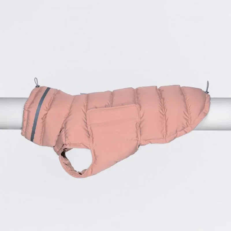 Waterproof and windproof pink dog coat hanging on a rail, featuring insulated padding and adjustable closures for warmth and comfort.