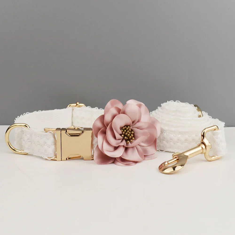 Luxurious white lace dog harness set with elegant gold-tone hardware and detachable pink flower, perfect for dog wedding attire.