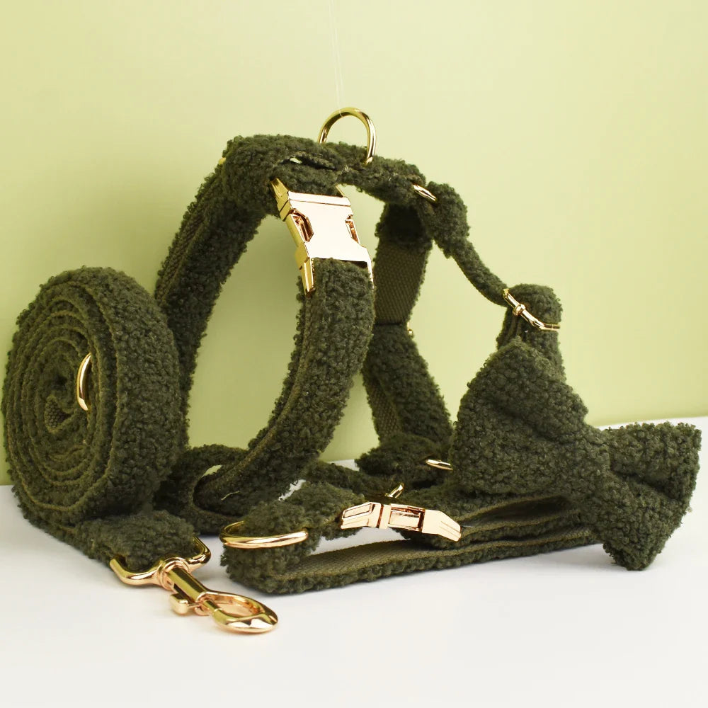 Handmade Teddy Fabric pet accessories in forest green with gold hardware, including harness, collar, lead, and bowtie.