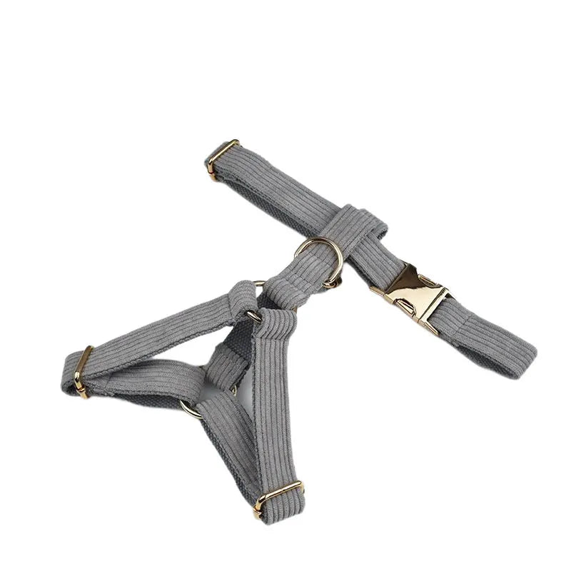 Light grey corduroy dog harness with gold metal hardware, luxury pet accessory.