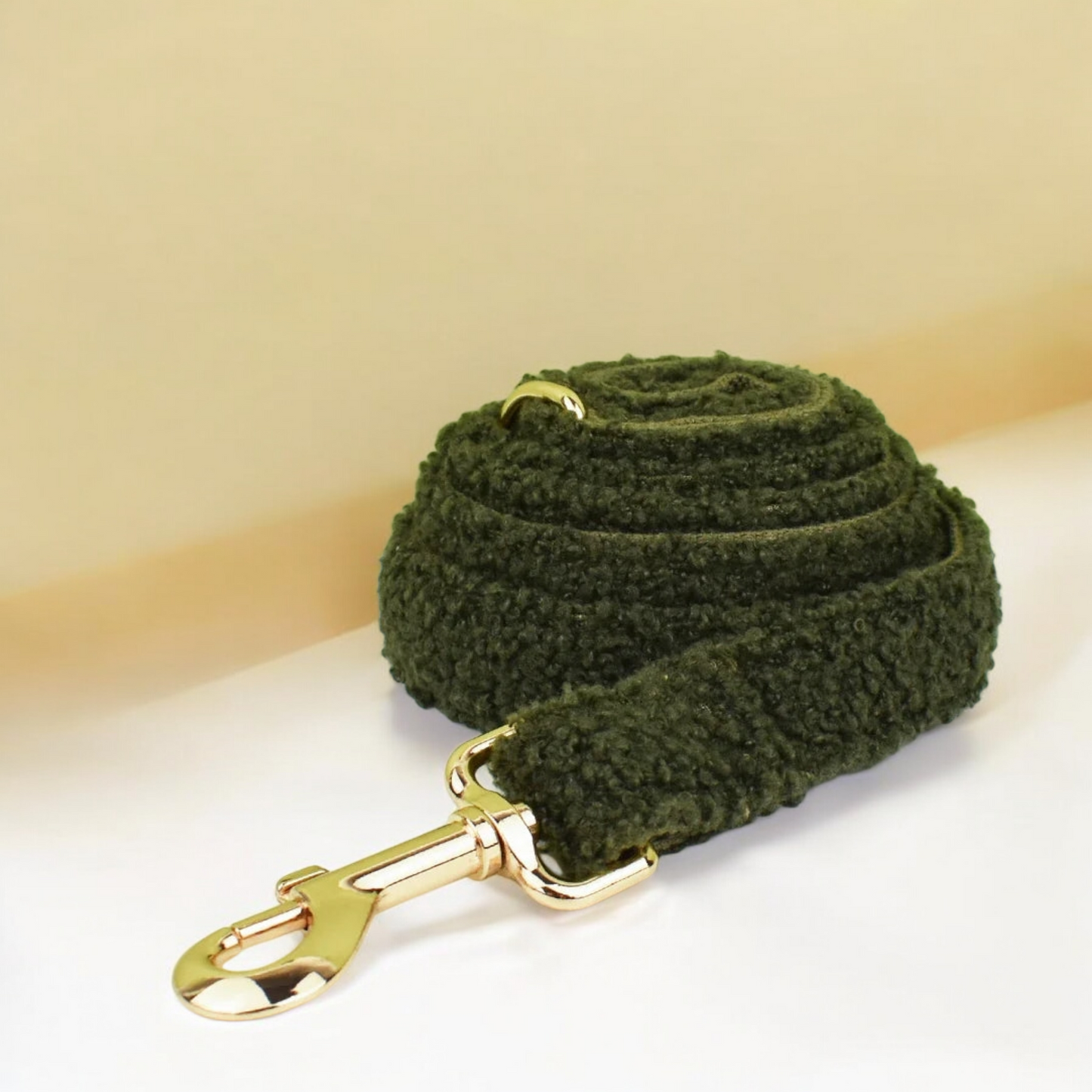 Forest green teddy fleece dog lead with gold hardware.
