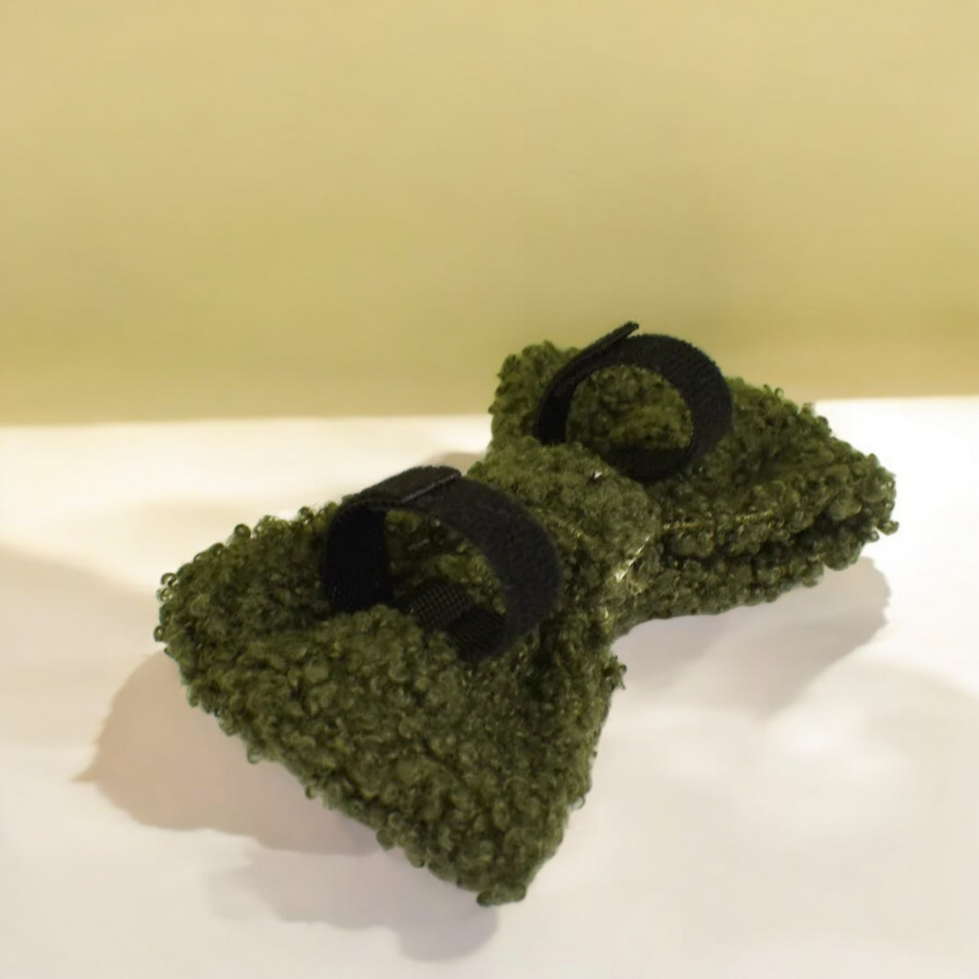Forest green teddy fleece dog bow with velcro collar loop attachment.