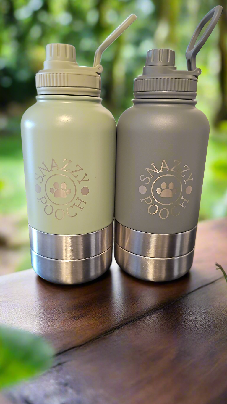 Portable Snazzy Pooch 3-in-1 dog water bottles in sage green and grey on table.
