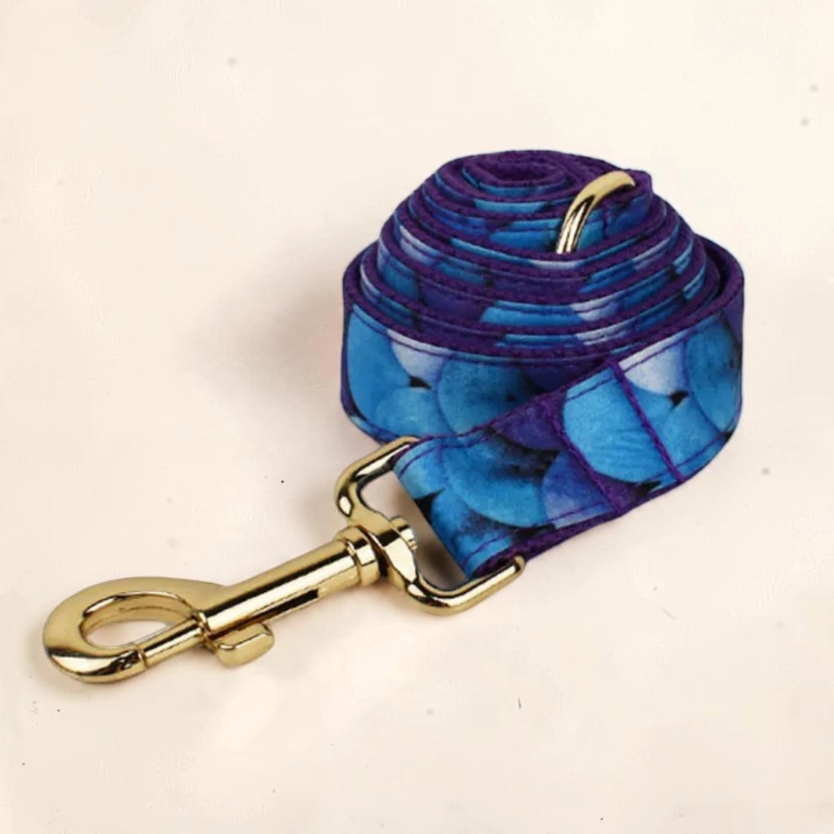 Blue bloom dog lead with gold clip.