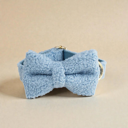 Blue fleece bow on a beige background