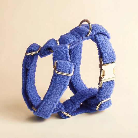 Blue teddy fleece dog harness on a beige background