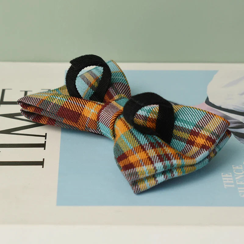 Handmade tartan bow tie in heather green for luxury pet accessories.